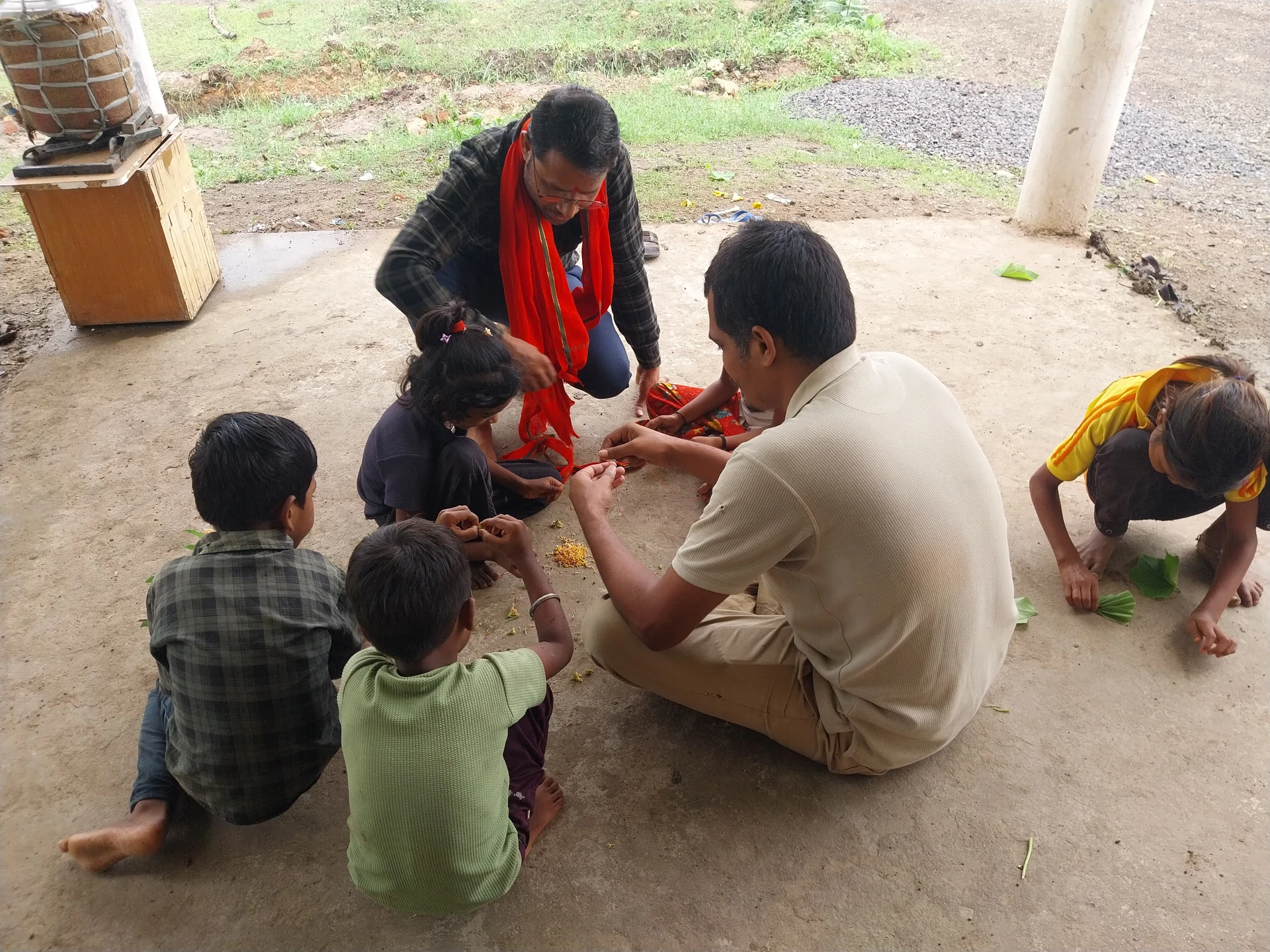 Mentors and children working together on the farm