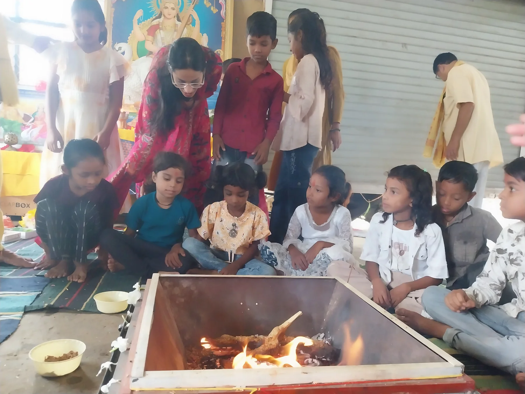 Children and mentors in thoughtful dialogue on the farm